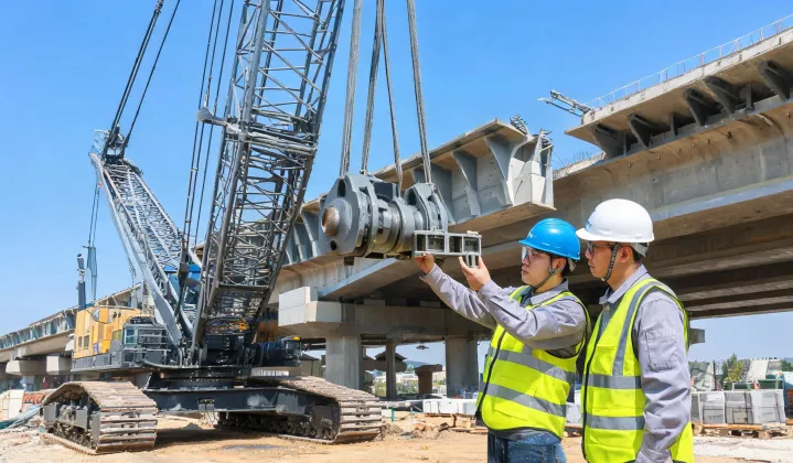 Engineers verifying crawler crane SWL on bridge site