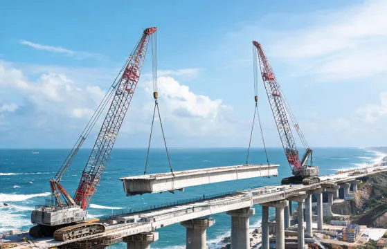 Crawler crane tandem lift of precast bridge girder